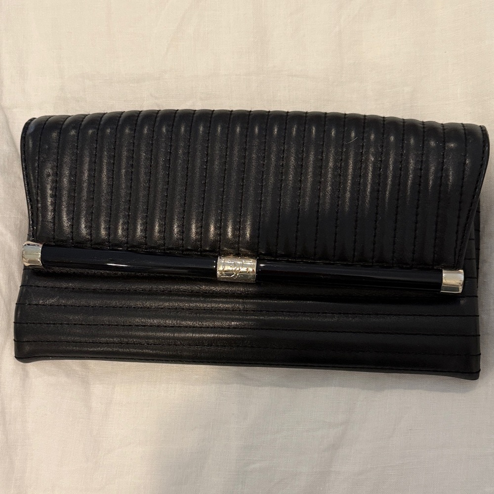 Diane Von Furstenberg Black Quilted Leather Clutch with gold and black resin Bar